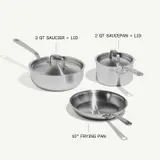A stainless steel cookware set features a 3-quart saucier with a lid, a 2-quart saucepan with a lid, and a 10-inch frying pan.