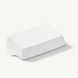 A white, rectangular electronic device rests on a plain surface, casting a slight shadow to its right.