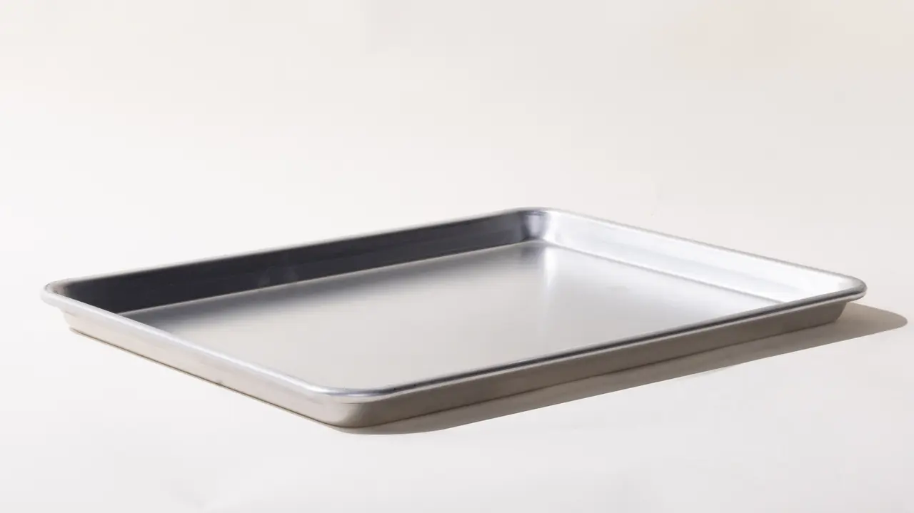 A simple, empty metal baking tray on a white background.
