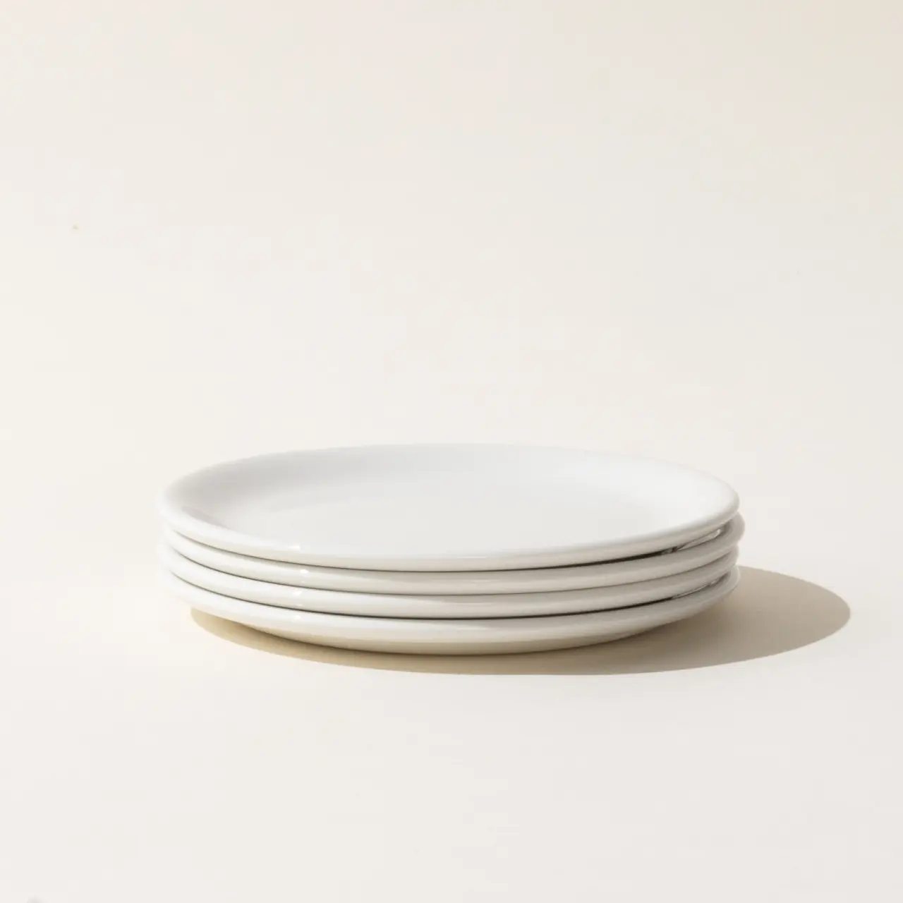 undecorated bread and butter plate stack