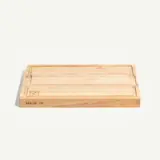 A rectangular wooden cutting board with engraved branding and a smooth surface, designed for food preparation.