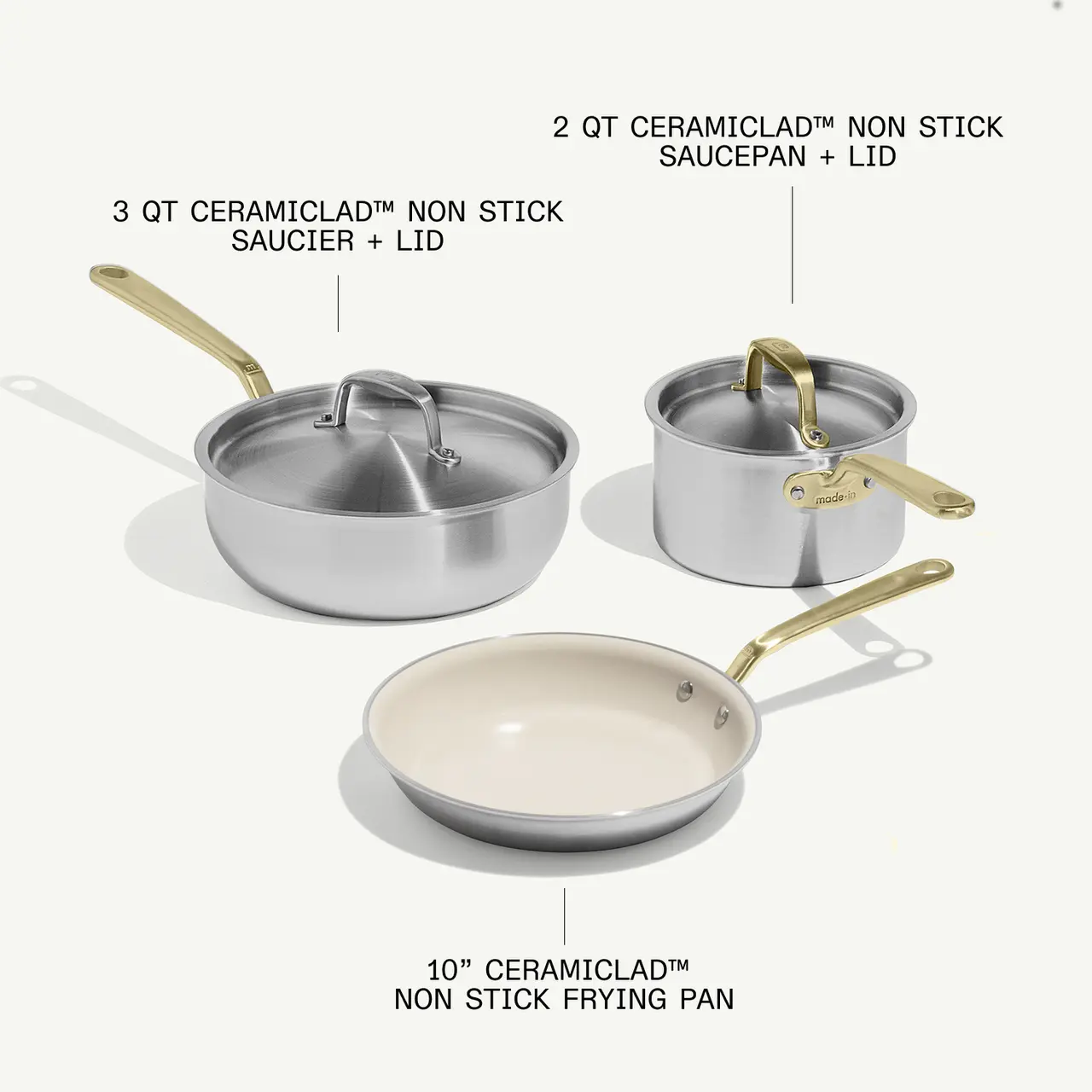 Three types of non-stick cookware are displayed: a 2-quart saucepan with lid, a 3-quart saucier with lid, and a 10-inch frying pan.
