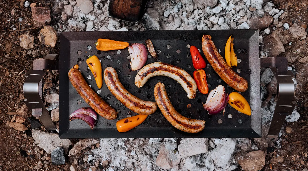 sausages and peppers on grill griddle
