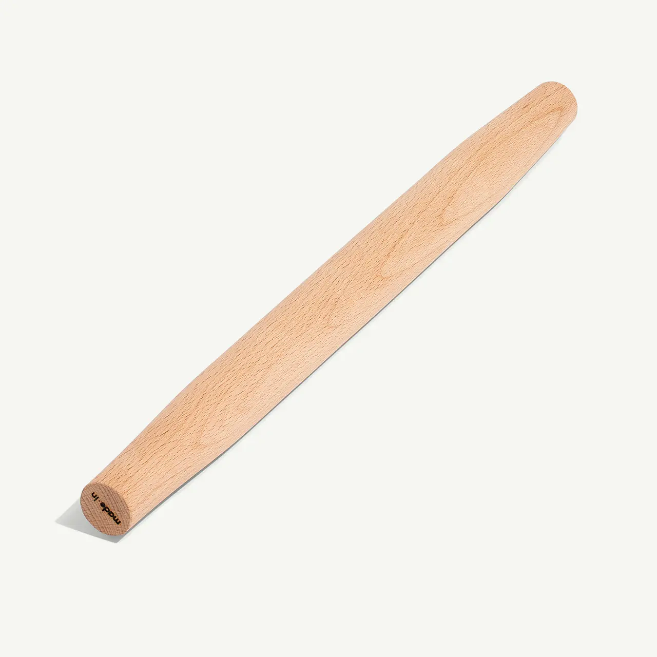 A wooden tongue depressor is displayed against a plain light background.
