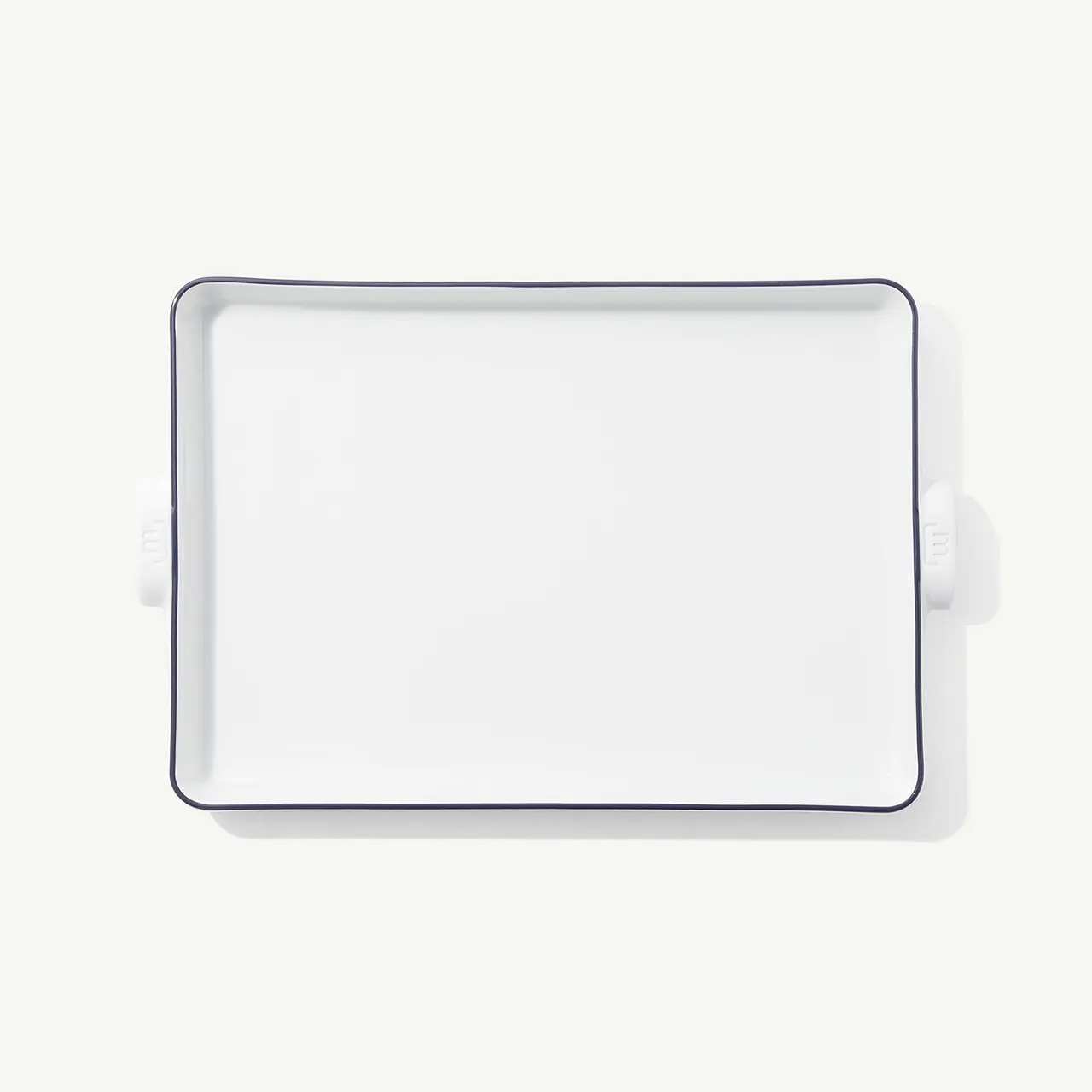 A white rectangular ceramic baking dish with handles on a white background.