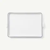 A white rectangular ceramic baking dish with handles on a white background.