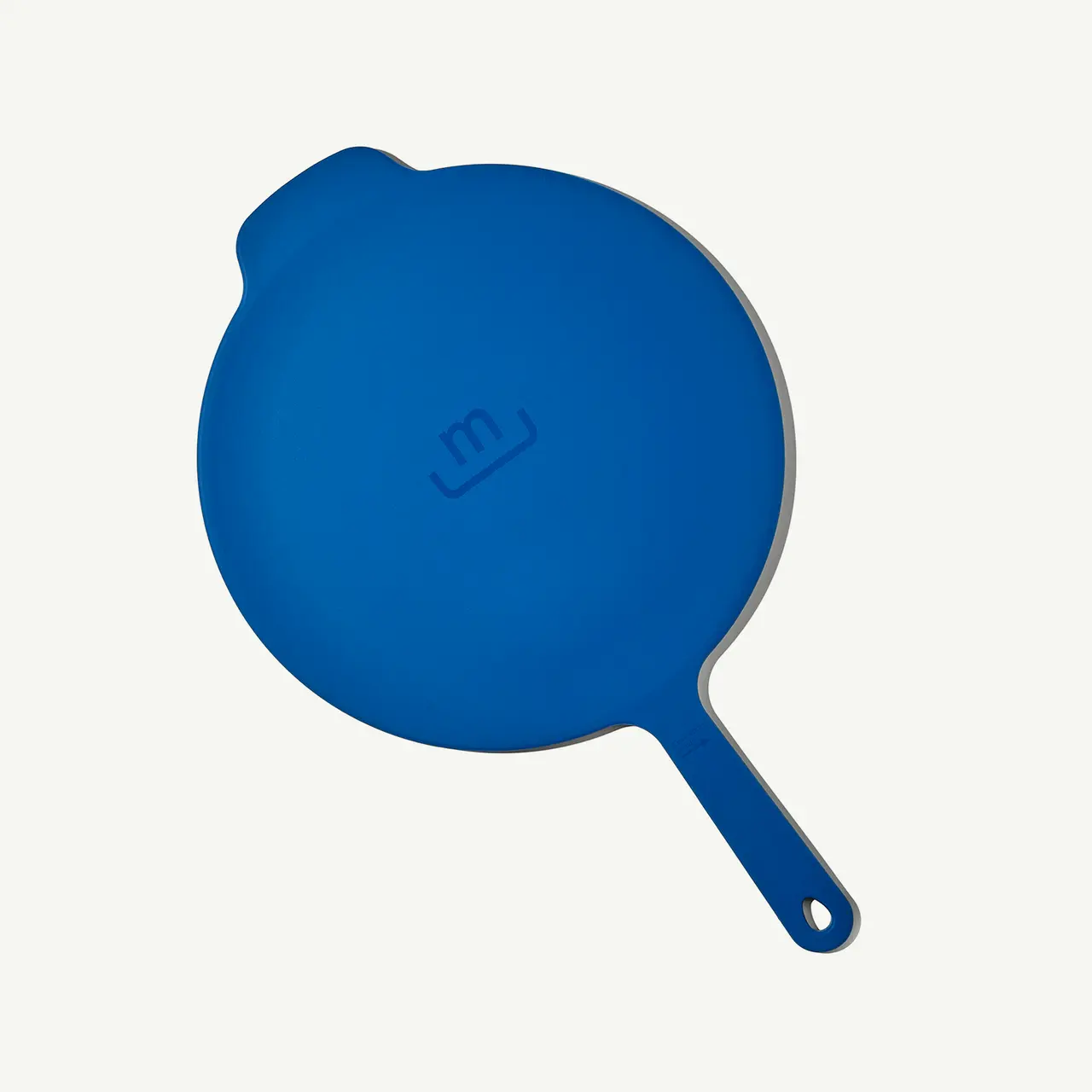 A blue silicone hot handle holder for cast iron skillets is displayed against a light background.