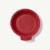 A red silicone cupping tool with "MADE IN" text embossed at the handle, displayed against a white background.