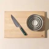 6 inch chef knife, mise en place bowls, butcher block cutting board