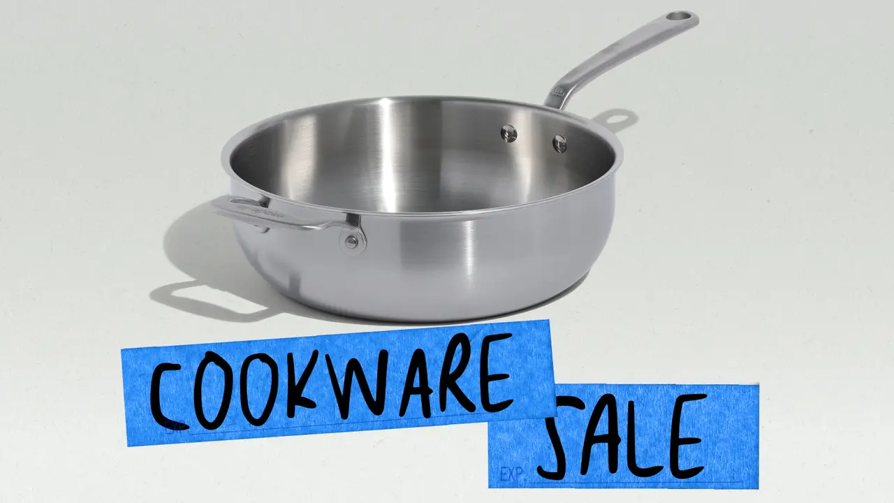 A stainless steel frying pan is displayed above a blue sign that reads "COOKWARE SALE."