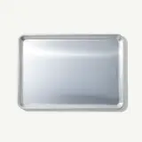 A stainless steel tray with rounded corners on a light background.