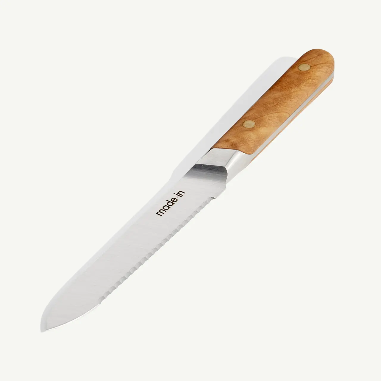 A stainless steel kitchen knife with a wooden handle is displayed against a white background.