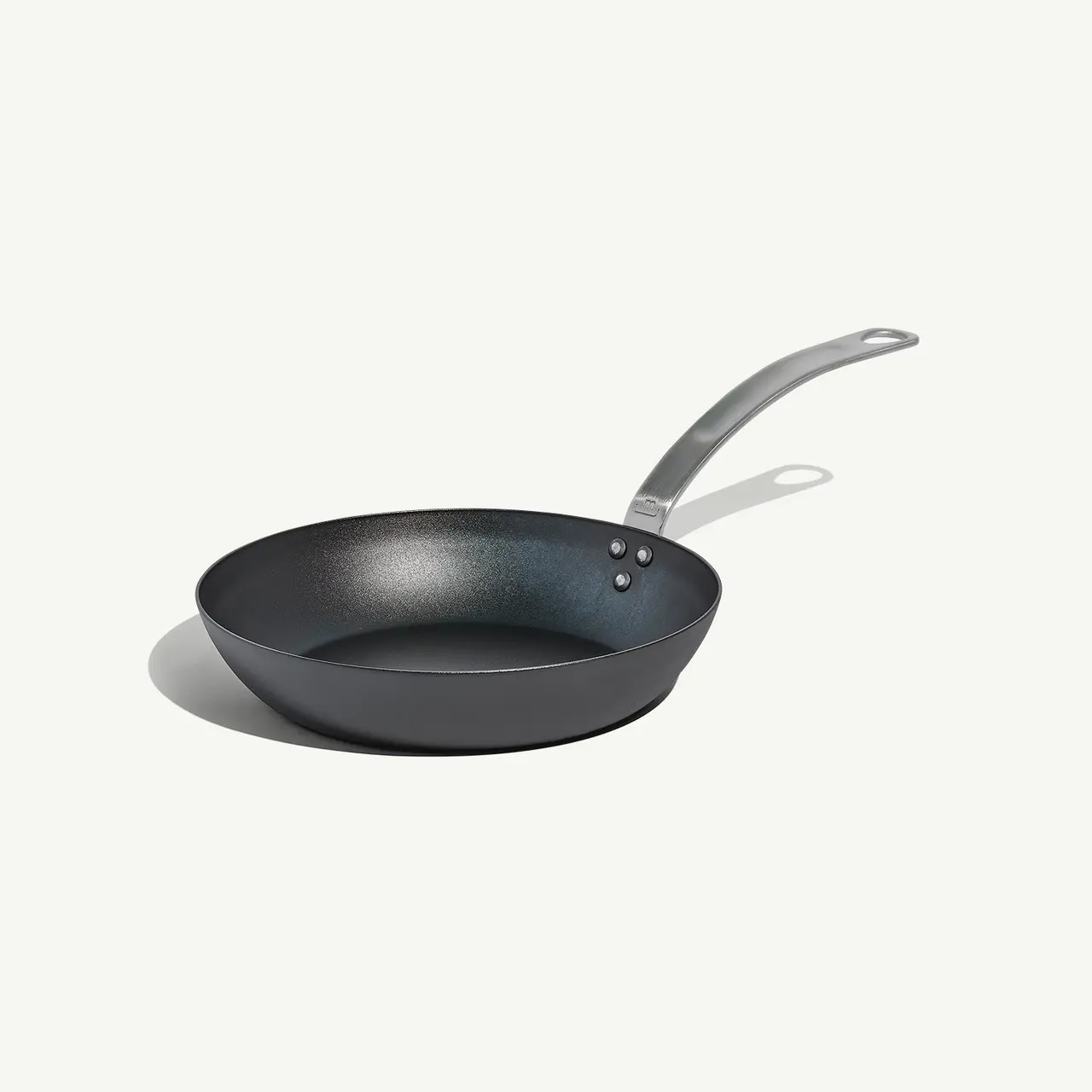 A non-stick frying pan with a stainless steel handle is showcased on a plain background.