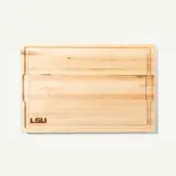 A wooden cutting board with a smooth surface and "LSU" engraved on one side.
