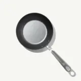 A round, non-stick frying pan with a stainless steel handle is displayed from a top-down view.