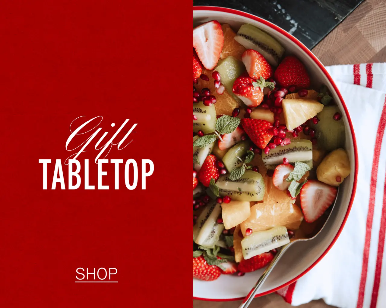 A vibrant fruit salad is displayed on one side, accompanied by stylish text promoting "Gift Tabletop" and a "Shop" button on the other side.