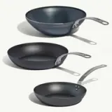 Three cookware items in varying sizes and shapes, featuring a modern design and a sleek, dark finish.