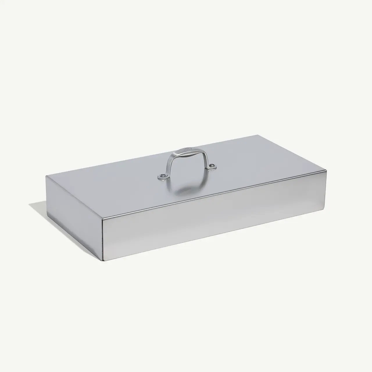A gray rectangular tool box with a centered silver handle on a white background.