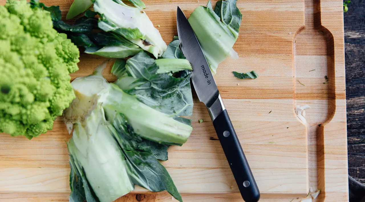 paring knife cutting lettuce