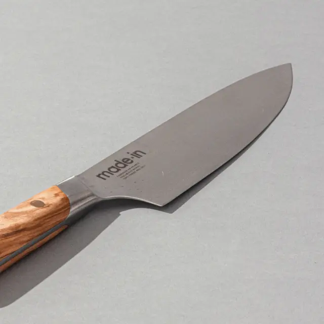 Wooden handled chef knife on grey background