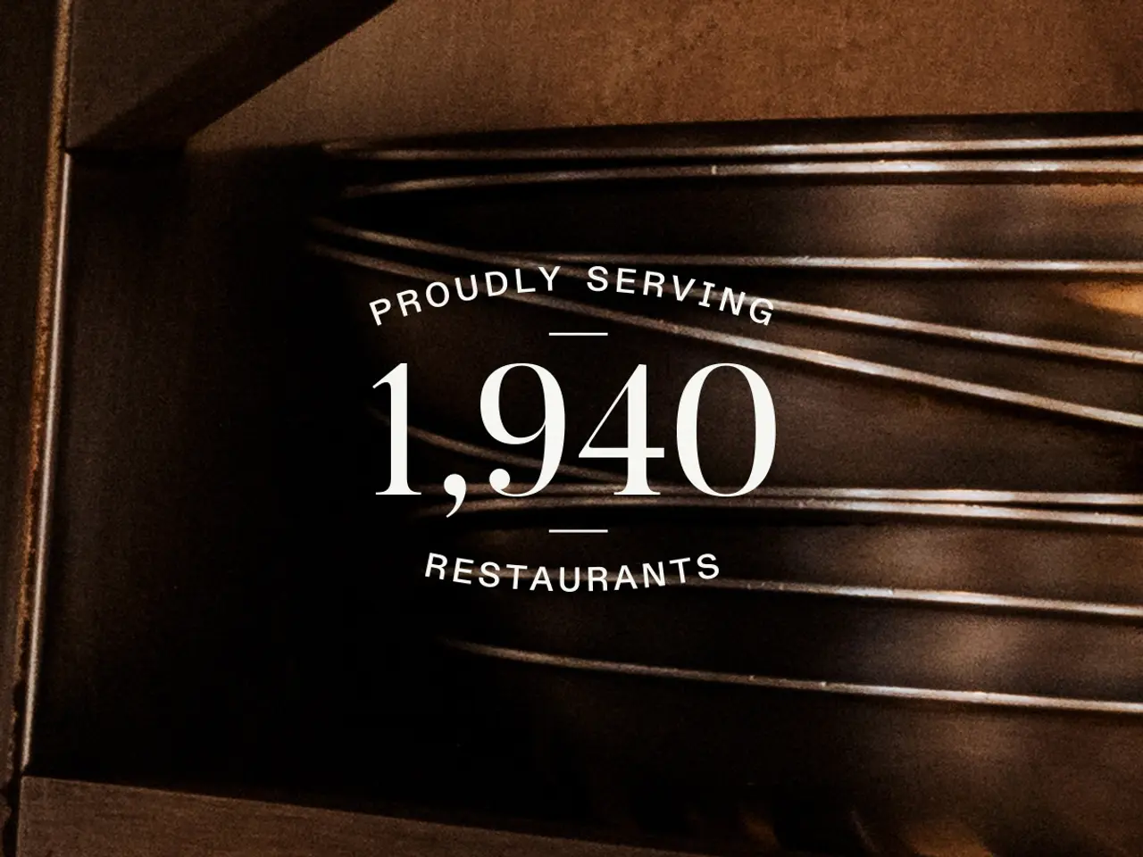 A metallic plaque displays "PROUDLY SERVING 1,940 RESTAURANTS" against a dark background with slatted details.