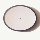 A top-down view of a round, white robotic vacuum cleaner against a pale background.