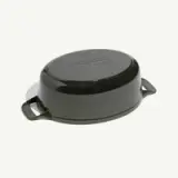 A black, oval ceramic baking dish with side handles and a smooth glossy finish.