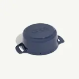 A blue enameled saucepan lid with two handles, viewed from above on a white background.