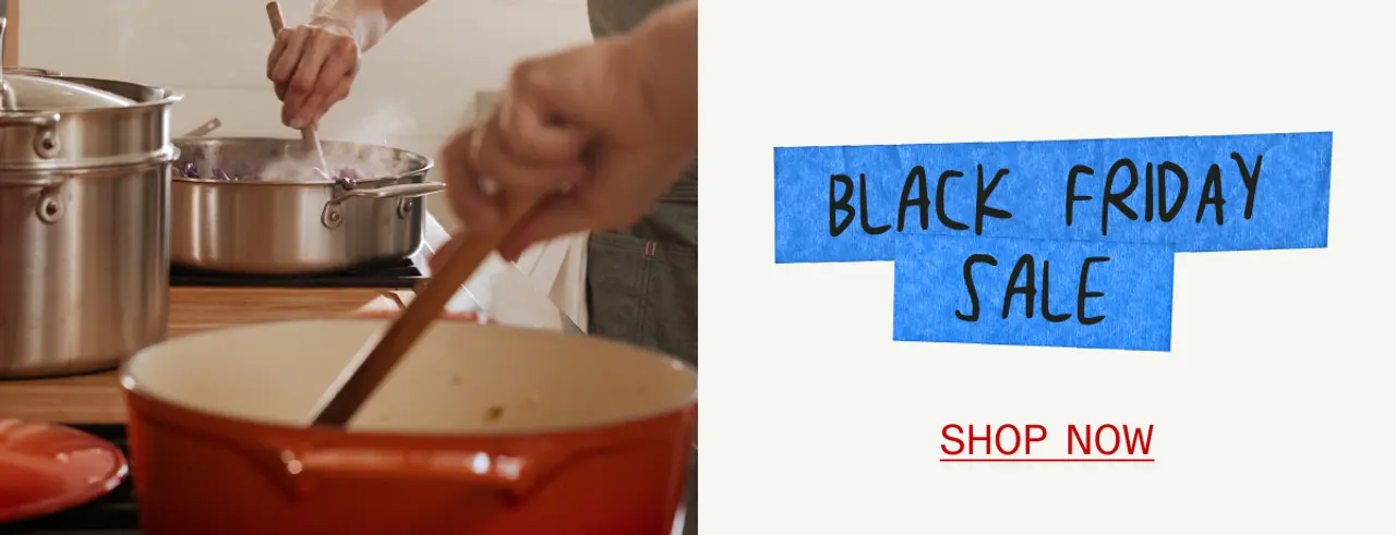 A hand stirs a pot on the stove alongside a promotional graphic for a Black Friday sale.