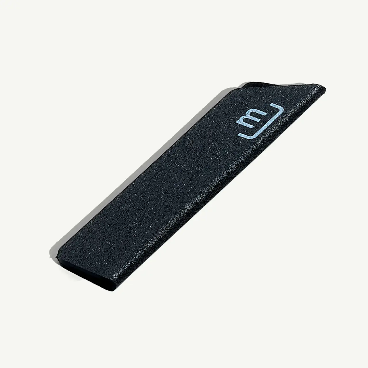 A black Juul e-cigarette device with the brand's logo on a gray background.