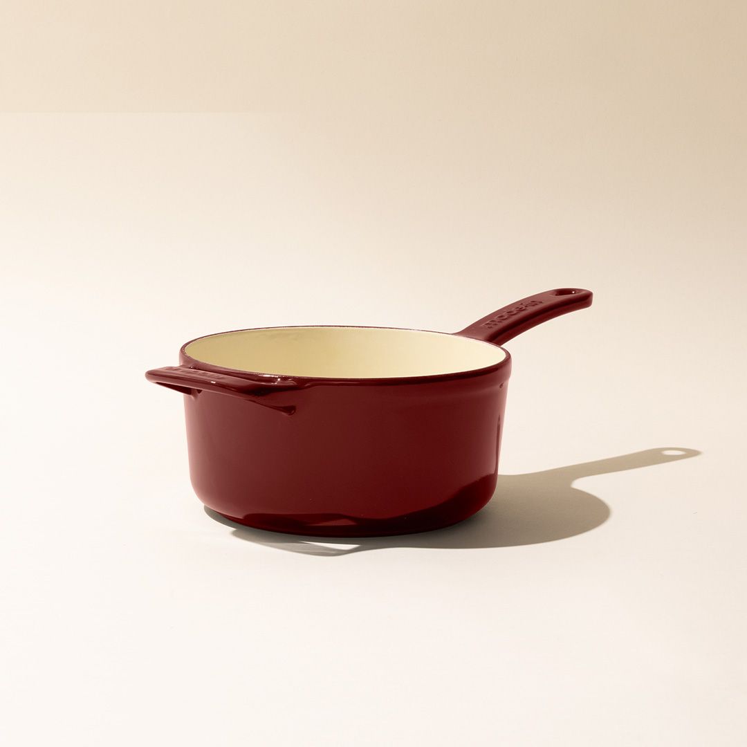 red enameled small cast iron cauldron