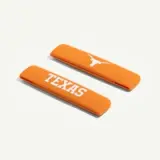 Orange hair clips featuring the word "TEXAS" and a Longhorn logo.