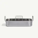 A stainless steel rectangular pan with compartments and a handle, set against a light gray background.