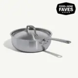 A stainless steel sauté pan with a lid and a long handle is featured alongside a badge that reads "FOOD & WINE FAVES."