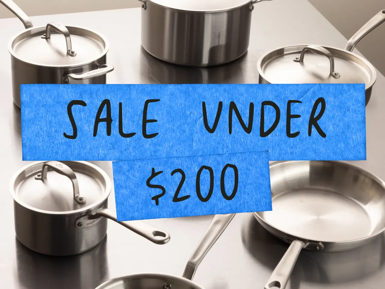 A collection of stainless steel cookware is displayed with a blue banner announcing a sale for items under $200.