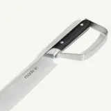 A close-up of a stainless steel kitchen knife with a black handle and the brand "made.in" engraved on the blade.