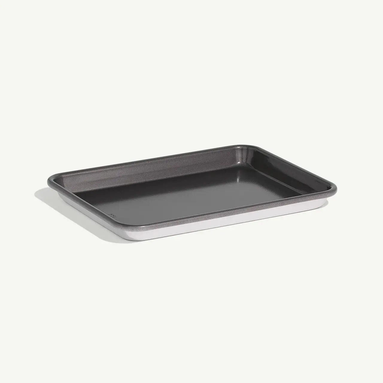 A simple metal baking tray is displayed against a light background.