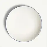 A plain white plate with a simple blue border is displayed against a light background.