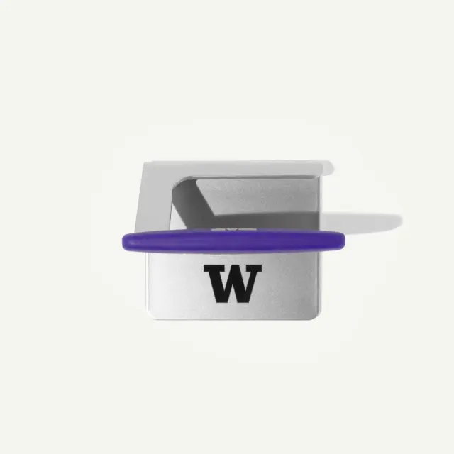 A silver and purple tool with a "W" logo, designed for holding or gripping items.