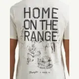 A light-colored t-shirt features a vintage-style illustration on the back, depicting a cowboy sitting by a campfire with the text "HOME ON THE RANGE" above.