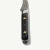 A close-up view of a pocket knife with a black handle and metallic blade against a white background.