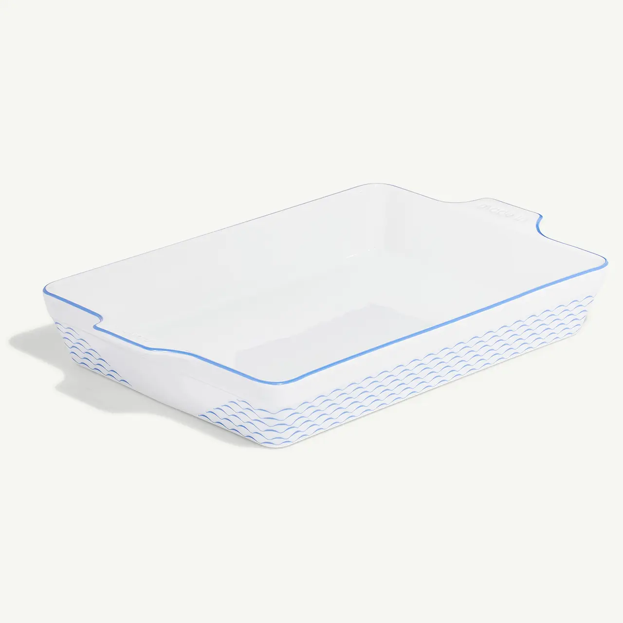 A white rectangular ceramic baking dish with blue trim and a woven pattern design on the exterior.