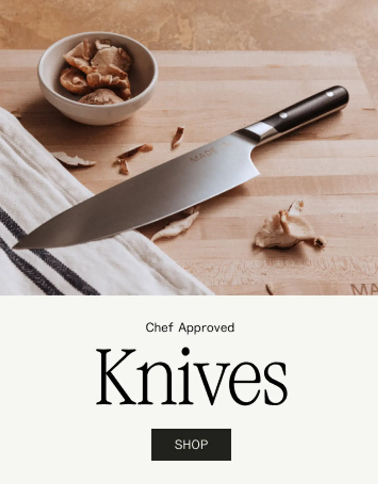 A chef-approved knife rests on a wooden cutting board alongside dried ingredients and a small bowl.