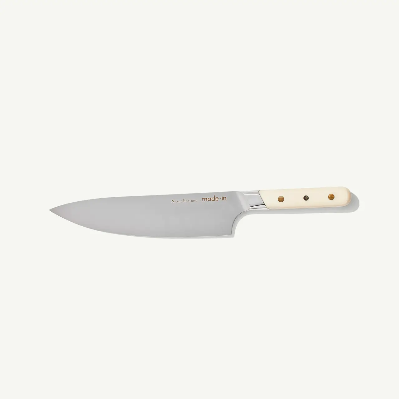 A chef's knife with a stainless steel blade and a riveted handle is shown against a plain background.