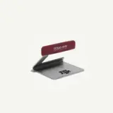 A desk accessory featuring the Texas A&M University logo and name in maroon on a silver base.