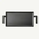 A black cast iron griddle with two handles on a light background.