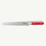 A serrated bread knife with a red handle is displayed against a white background.