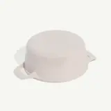 A pale pink ceramic pot with handles and a visible brand name on the lid, isolated against a white background.