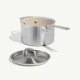 A stainless steel cooking pot with a white interior and a matching lid is displayed.