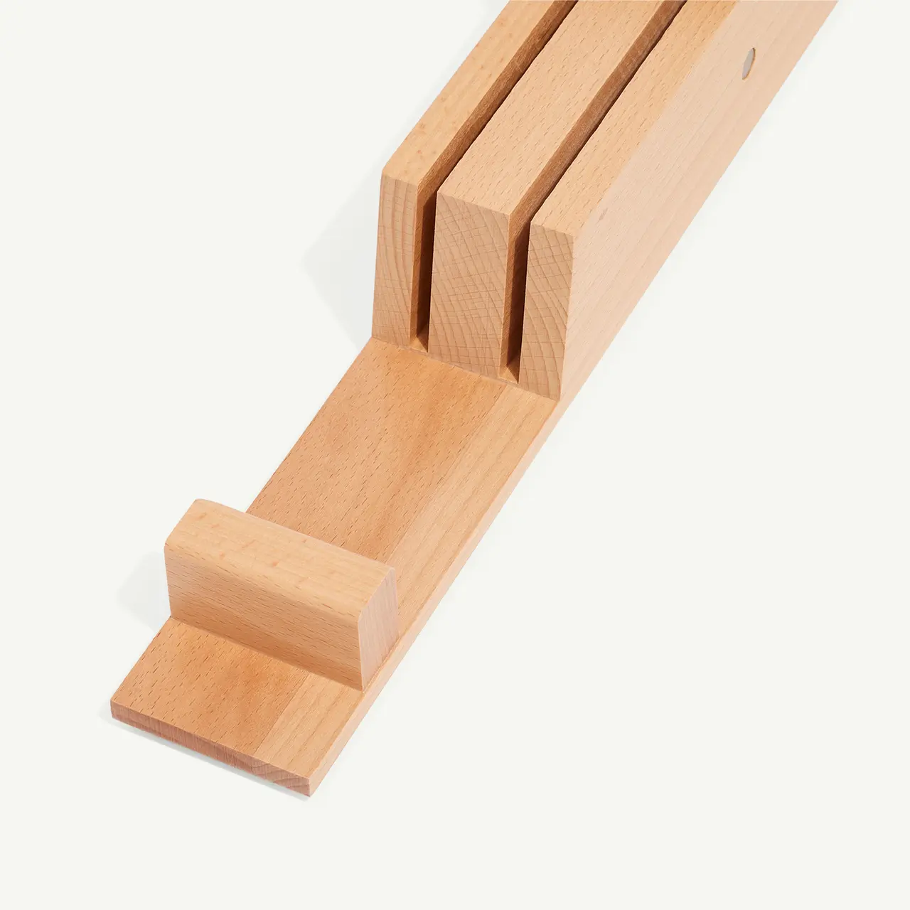 A wooden block puzzle with one piece partially slid out, against a white background.